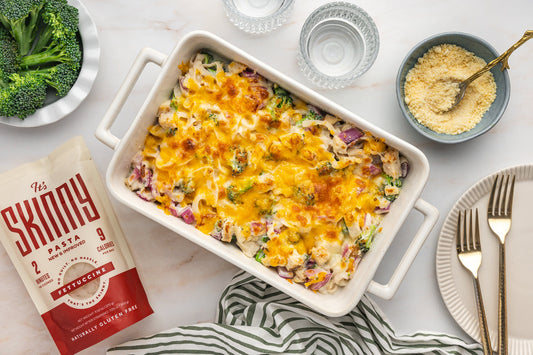An overhead image of a casserole dish filled with creamy, cheesy chicken divan casserole.