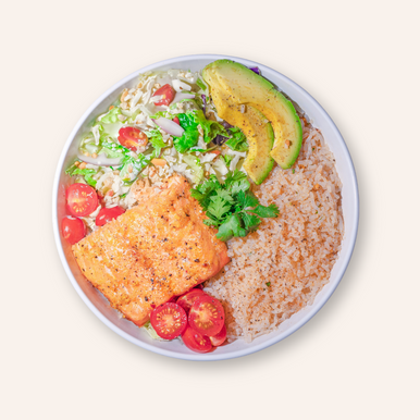 An overhead image of an It's Skinny Organic Rice bowl with salmon, avocado, and tomatoes.